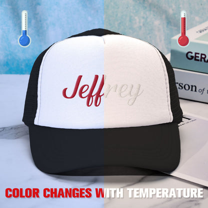 Demonstration of the temperature-sensitive foam changing colour on a custom puff print trucker hat when warmed, an interactive personalised cap feature