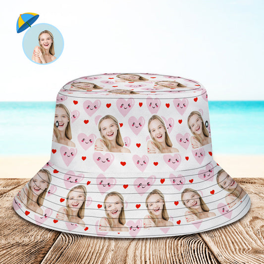 Folded personalised pink heart bucket hat flat to show polyester fabric and compact, no‑deformation design, perfect personalised summer sun hat with UV protection