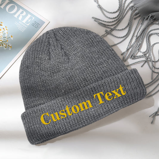 Front view of a personalised knitted beanie showing custom text on the cuff — unisex adult winter warm cap in soft elastic acrylic, ideal for daily wear and outdoor sports