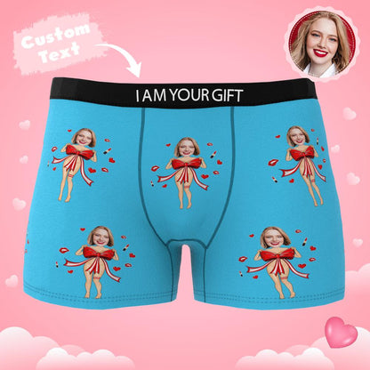 Customer example of personalised face placement on black boxers with red bow — playful personalised gift idea