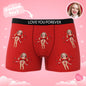 Gifting scene showing personalised photo boxers with red bow being presented — custom gift for husband or boyfriend