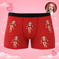 Customer example of personalised face placement on black boxers with red bow — playful personalised gift idea
