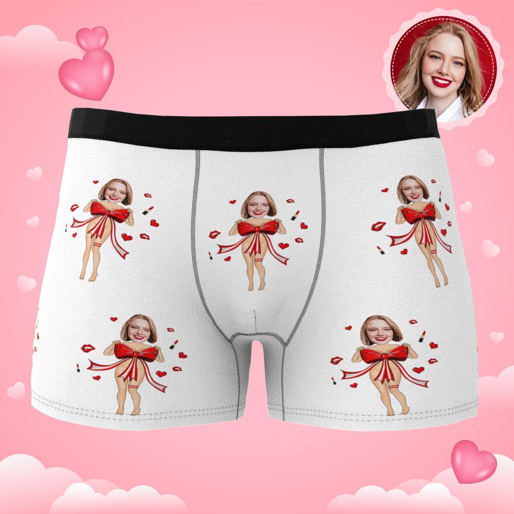 Product layout showing face placement and red bow design on personalised photo boxers with AR animation feature