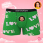 Pair of personalised boxers displayed flat to show positioning of custom face print and vibrant colour reproduction