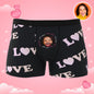 Flat-lay of personalised boxer shorts with cropped face design and vivid colours – bespoke photo gift for boyfriend
