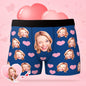 Product flat-lay of personalised men's boxer briefs with custom photo and tiny heart emblem, available in multiple colours and sizes and ideal as a personalised gift