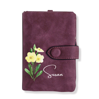 Selection of personalised birth flower wallet card holders displaying various birth month floral designs on soft PU leather