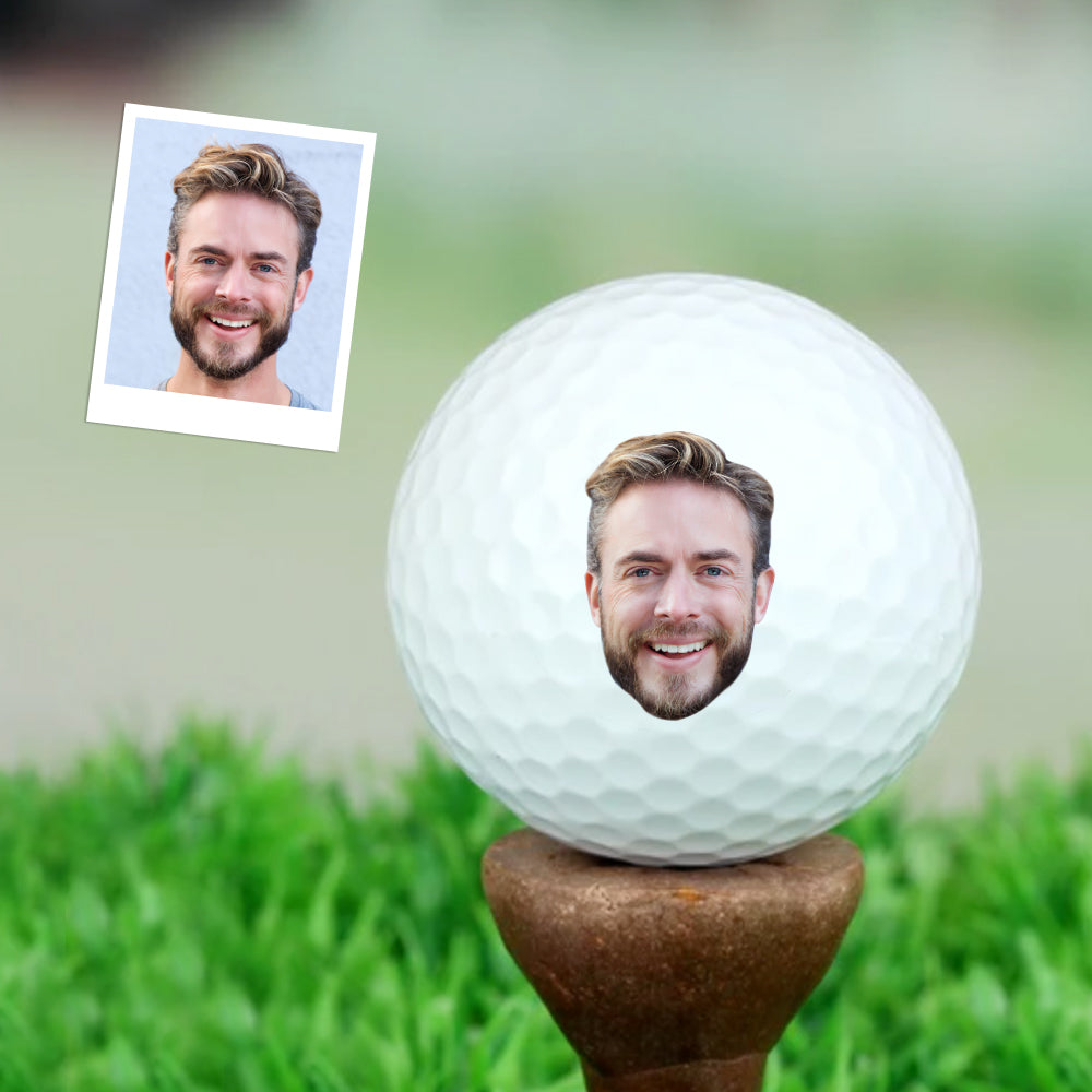 Close-up of customised golf ball with clear photo print and wind‑tunnel dimple design for improved distance and accuracy