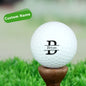 Personalised engraved name golf ball with UV-printed custom text, white rubber wind-tunnel surface for improved distance and accuracy, ideal custom golf gift
