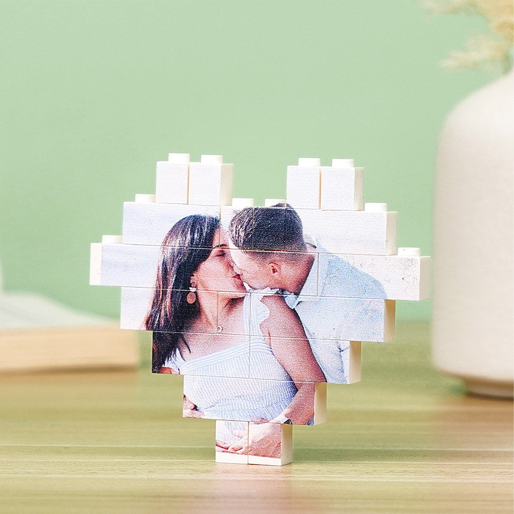 Custom heart-shaped photo block puzzle assembled on a table, personalised building brick keepsake with vibrant UV-printed family photo