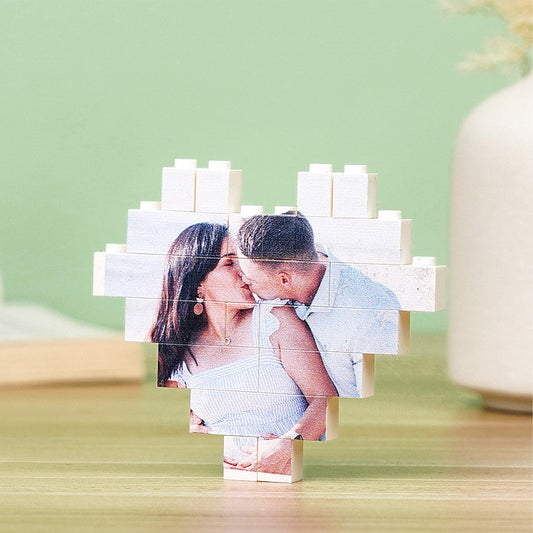 Custom heart-shaped photo block puzzle assembled on a table, personalised building brick keepsake with vibrant UV-printed family photo
