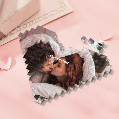 Child assembling a personalised heart-shaped brick puzzle — educational DIY custom photo toy that improves problem solving
