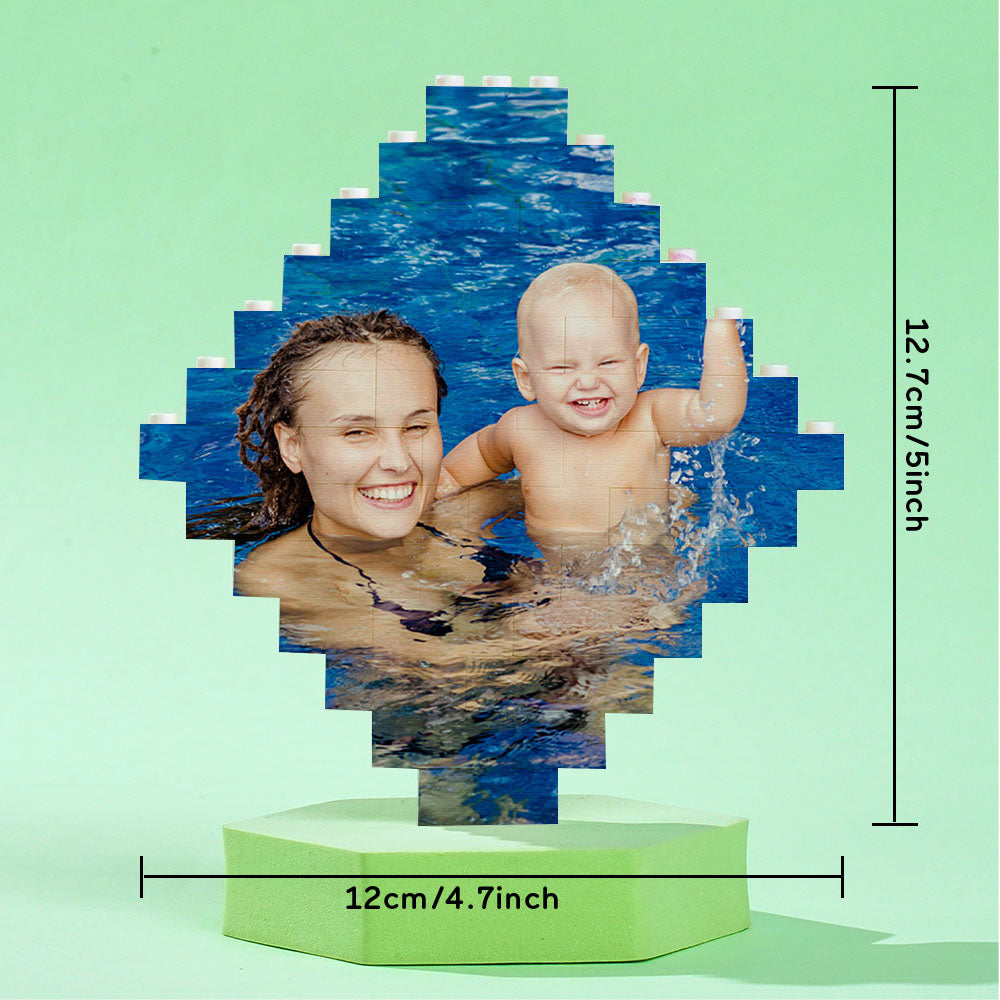 Top view of lozenge-shaped personalised photo bricks showing printed faces — custom educational stacking bricks