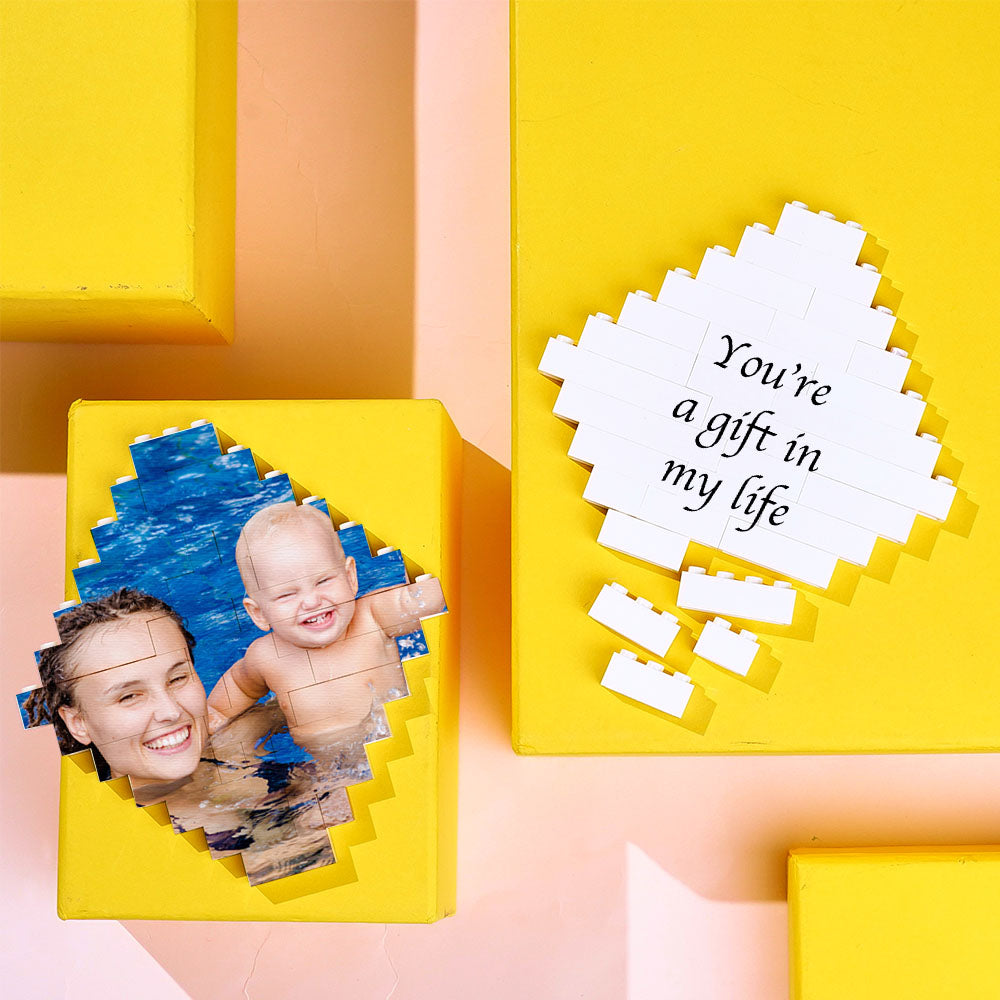 Collection of personalised photo lozenge building bricks stacked into a creative tower — educational personalised toy