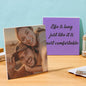 Square photo tiles displayed on tabletop as a unique DIY personalised photo gift