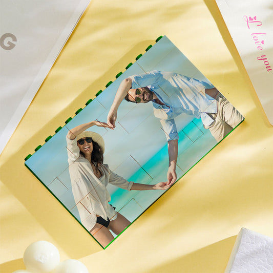 Personalised green building block photo puzzle assembled as horizontal photo bricks showing a vibrant, UV-printed family image on interlocking plastic blocks
