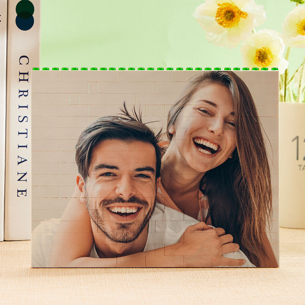 Personalised green building block photo puzzle assembled as horizontal photo bricks showing a vibrant, UV-printed family image on interlocking plastic blocks