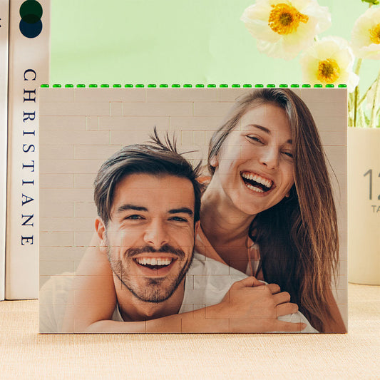 Personalised green building block photo puzzle assembled as horizontal photo bricks showing a vibrant, UV-printed family image on interlocking plastic blocks