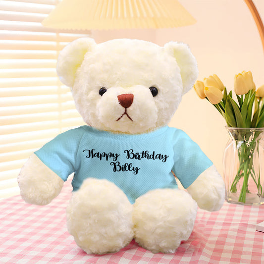 Close‑up of personalised embroidered text on teddy bear outfit — custom text personalisation for a unique stuffed animal gift