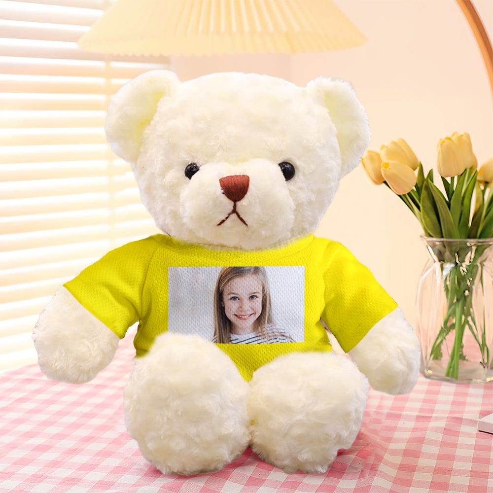 Lifestyle shot of personalised photo bear on a sofa, showcasing the 30cm plush as a cosy custom photo keepsake gift
