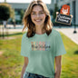 Teacher wearing personalised T‑shirt in a classroom setting — thoughtful personalised name gift for mentors and colleagues