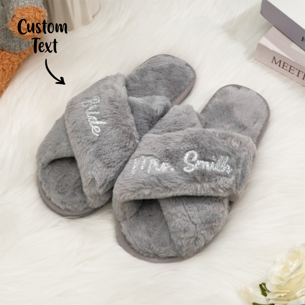 Detail of custom personalisation on fluffy cross slippers - add names or short text for bespoke bridesmaid or bride gifts