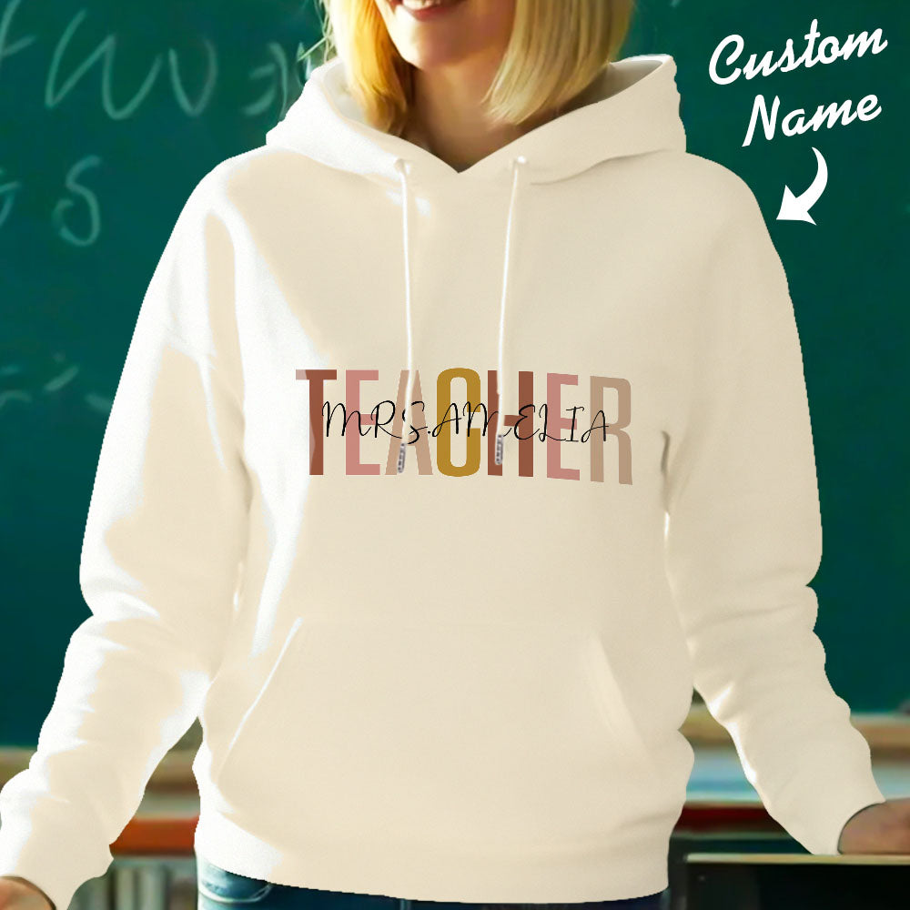 Model wearing personalised teacher hooded sweatshirt with custom name on back — comfortable polyester hoodie perfect for teacher appreciation