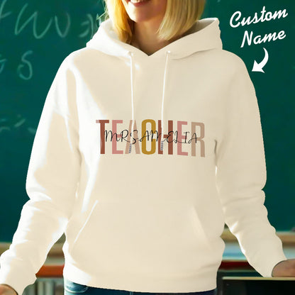 Model wearing personalised teacher hooded sweatshirt with custom name on back — comfortable polyester hoodie perfect for teacher appreciation