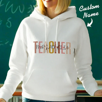 Flat-lay of personalised teacher hoodie showing front pocket and hood — versatile custom name hoodie ideal for personalised clothing gifts
