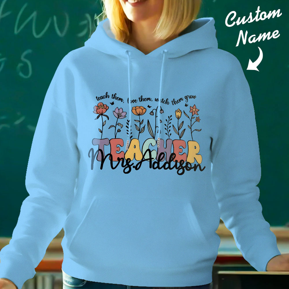 Detail shot of polyester fabric and print clarity on the personalised wildflower hoodie — guidance for care and quality of this custom name hoodie