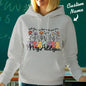 Lifestyle image of the personalised wildflower hooded sweatshirt styled casually — recommended custom name hoodie for back-to-school and graduation