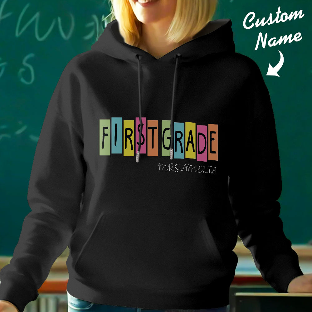 Back view of personalised first grade teacher hoodie showing name customisation on the rear — polyester hooded sweatshirt for teachers.