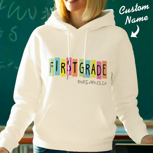 Personalised first grade hooded sweatshirt (polyester) — front view with customised teacher name; ideal teacher custom name hoodie.