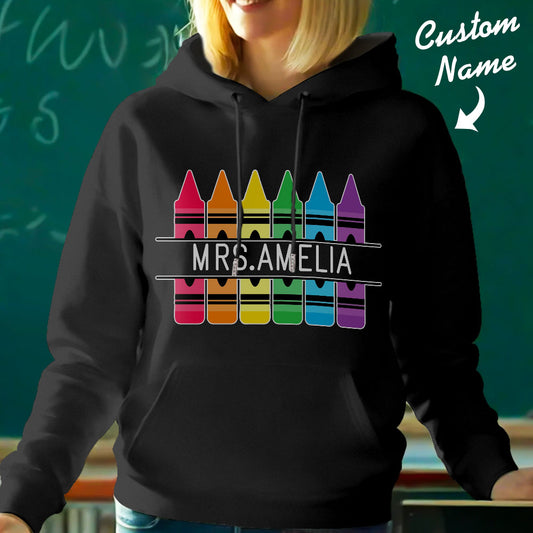 Personalised Crayon Hooded Sweatshirt front view with custom name — colourful crayon graphic, perfect teacher gift and back-to-school present