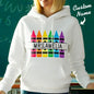 Flat-lay display of personalised crayon hooded sweatshirt with custom name — ready as a thank-you gift for teachers and mentors