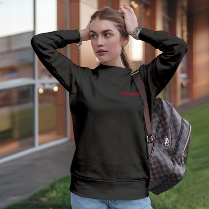 Couple wearing matching personalised hoodies in a casual photoshoot — embroidered Roman numeral date for a thoughtful gift