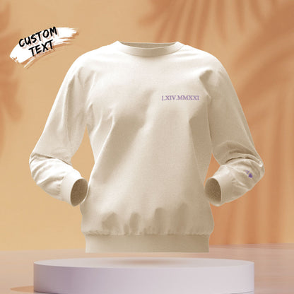 Flat-lay of personalised embroidered hoodie showing round-neck style and custom text placement — perfect keepsake gift