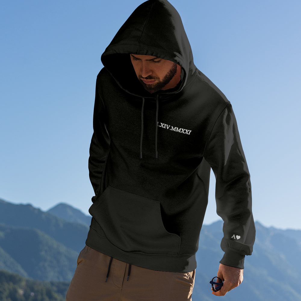 Unisex personalised hoodie showing embroidered date in Roman numerals — comfortable everyday cotton wear
