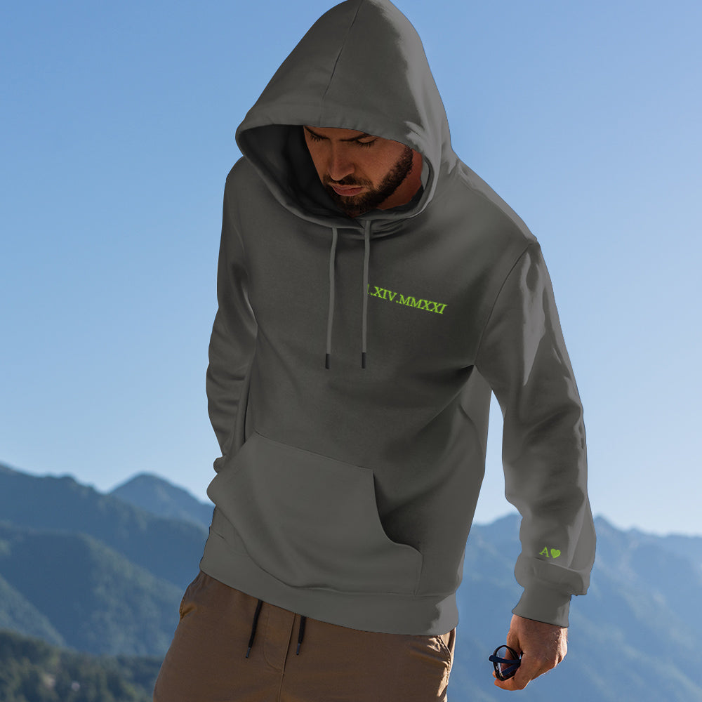 Two personalised hoodies side by side — matching Roman numeral date embroidery for couples and families