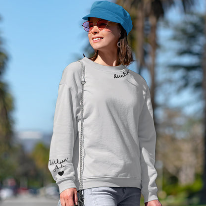 Side view of custom name hoodie showing relaxed unisex fit and sleeve detail on personalised sweatshirt