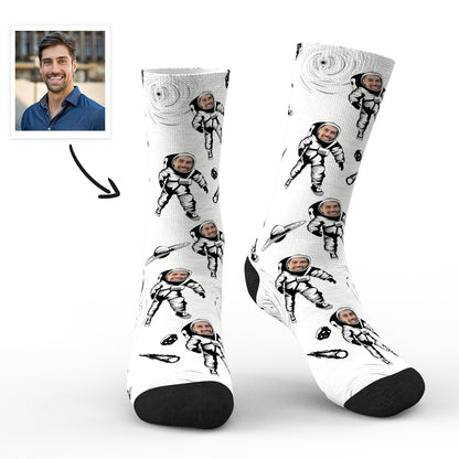 Pair of personalised astronaut socks with a clear custom face preview on the helmet, flat lay on white background — personalised astronaut socks and custom face socks for men, women and teens
