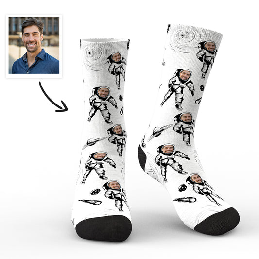 Pair of personalised astronaut socks with a clear custom face preview on the helmet, flat lay on white background — personalised astronaut socks and custom face socks for men, women and teens