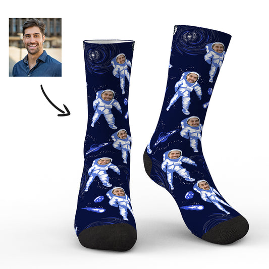 Pair of personalised astronaut socks with a clear custom face preview on the helmet, flat lay on white background — personalised astronaut socks and custom face socks for men, women and teens