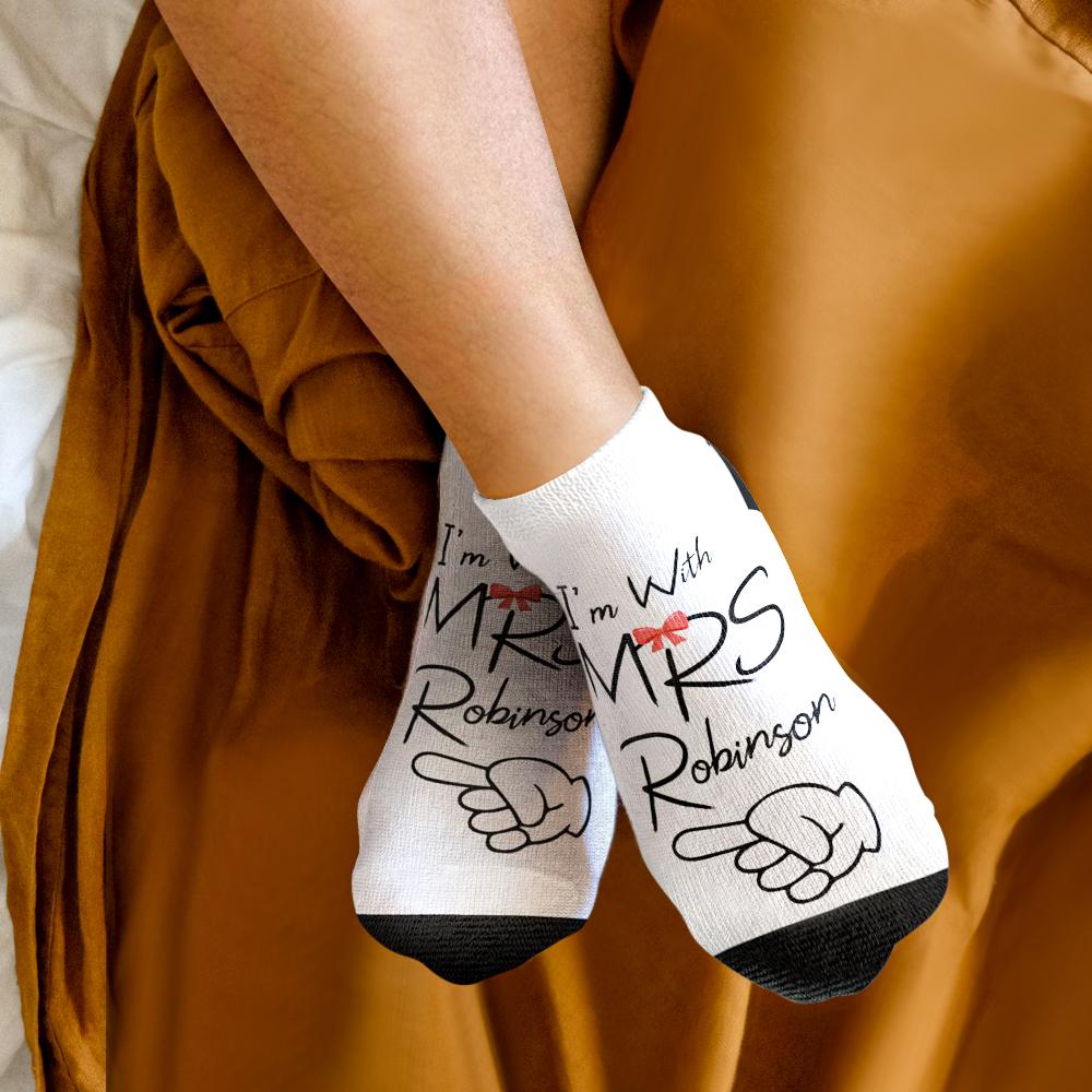 Matching bride and groom socks worn on models’ feet — personalised honeymoon photo socks, custom printed for anniversaries and gifts