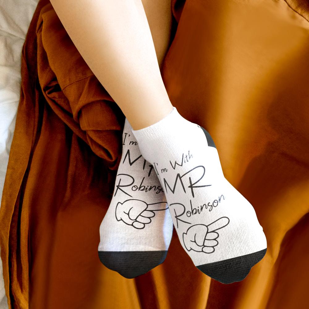 Pair of personalised photo socks featuring faces and a pet image — quirky personalised photo gift and honeymoon keepsake