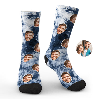 Model wearing personalised tie-dye photo face socks showing the face print on the front and colourful tie-dye swirl — novelty personalised socks