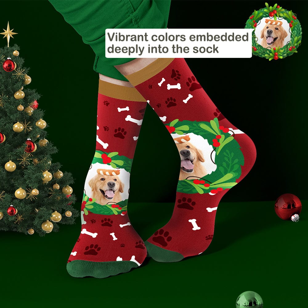 Detailed shot of red personalised photo pet socks showing a clear pet image with mistletoe & bone pattern – great festive stocking gift