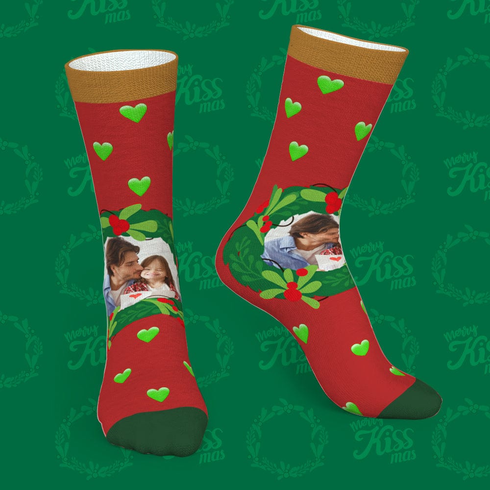 Pair of green custom mistletoe and heart Christmas socks showing printed photo option — personalised family gift