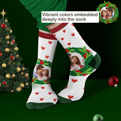 White pair of personalised mistletoe and heart Christmas socks showing custom photo and name options — thoughtful family gift