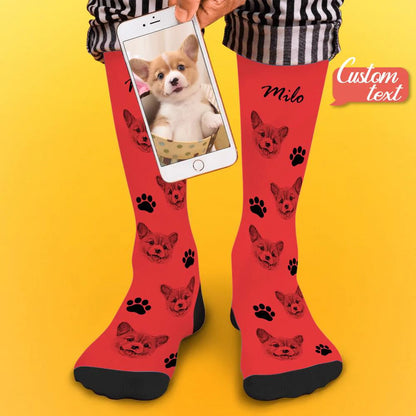 Model wearing personalised pet face photo socks with a clear pet portrait print and personalised name text visible